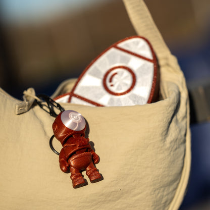 Rocket Rider: Astronaut Keychain with a Cosmic Rocket Capsule