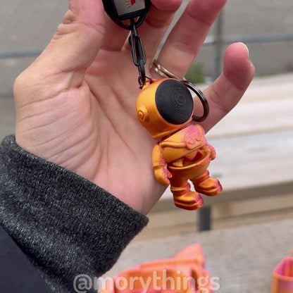 Rocket Rider: Astronaut Keychain with a Cosmic Rocket Capsule